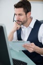 Smart businessman in white shirt verifying information from paper