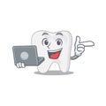 Smart cartoon character of tooth studying at home with a laptop Royalty Free Stock Photo