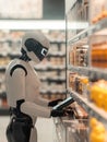 Smart cashier in supermarket as AI automates checkout process during busy shopping hours