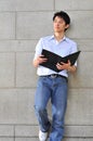 Smart Casual Looking Asian Man Reading