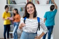 Smart caucasian female student with group of students Royalty Free Stock Photo