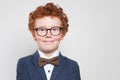 Smart child boy in glasses smiling on white background. Clever kid Royalty Free Stock Photo