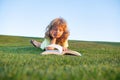 Smart child boy reading book in park outdoors on summer day. Clever kids. Royalty Free Stock Photo