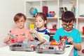 Smart children playing with educational toys. School, education, engineering and hobby concept. Kids doing school project with