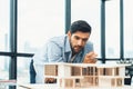 Smart civil engineer looking while planing design house construction. Tracery. Royalty Free Stock Photo