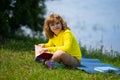 Smart clever Kids. Cute child read books outdoors. Kids learning and summer education. Child boy reading book outdoor on Royalty Free Stock Photo