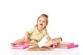 Smart, curious baby. Little girl, toddler sitting on floor with many books around against white studio background Royalty Free Stock Photo