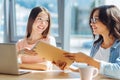 Smart delighted friends studying together