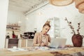 Smart designer drawing sitting alone at the table.