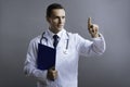 Smart doctor pointing up with his finger Royalty Free Stock Photo