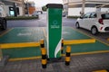 Smart Dubai car charging stations in parking lot. Charging modern electric cars new energy vehicles, NEV on the street station. Royalty Free Stock Photo