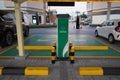 Smart Dubai car charging stations in parking lot. Charging modern electric cars new energy vehicles, NEV on the street station. Royalty Free Stock Photo