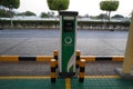 Smart Dubai car charging stations in parking lot. Charging modern electric cars new energy vehicles, NEV on the street station. Royalty Free Stock Photo