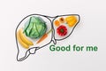 Smart eating. Creative collage made of organic vegetables and fruits with drawing of liver on white background