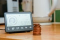 Smart energy meter in a home interior to monitor electricity usage in the house and reduce cost of living price Royalty Free Stock Photo