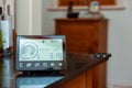 Smart energy meter in a home interior to monitor electricity usage in the house and reduce cost of living price Royalty Free Stock Photo