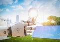 Smart energy with robot hold light bulb and work with solar panel Royalty Free Stock Photo