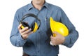 Smart Engineer Worker wear blue shirt and hold yellow safety helmet and Yellow Ear muffs on isolate background Royalty Free Stock Photo