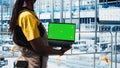 Smart factory technician manages robotic arms using mockup notebook