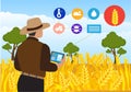 A smart farmer uses a tablet to guard a barley field. by monitoring the weather, humidity, pests, modern agricultural concepts