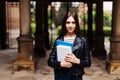 Young smart female college student on campus outdoors Royalty Free Stock Photo