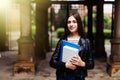 Young smart female college student on campus outdoors Royalty Free Stock Photo