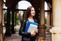 Young smart female college student on campus outdoors Royalty Free Stock Photo