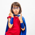 Fun superhero child raising her gifted fingers for critical mindset Royalty Free Stock Photo