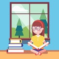 Smart girl in glasses reading a big book