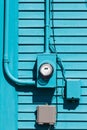 Smart grid electric meter connection on blue wall Royalty Free Stock Photo