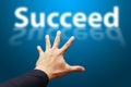 Smart Hand grab the word Succeed Royalty Free Stock Photo