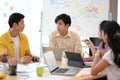 Male worker presents his ideas to his colleagues in the marketing discussion