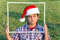 Smart and handsome boy in a clownish cap Royalty Free Stock Photo