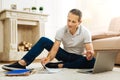 Smart handsome man feeling glad while working at home Royalty Free Stock Photo