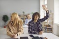 Smart high school or college student raising hand to answer or ask question in class Royalty Free Stock Photo