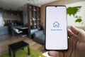 smart home app on smartphone. remote control of electronic devices in apartment. concept of controlling smart electronics in the Royalty Free Stock Photo