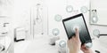 Smart home control concept hand touch digital tablet screen with icons, isolated on blurred bathroom background, web banner and Royalty Free Stock Photo