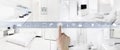 Smart home control concept hand touch icons screen with interiors, living room, kitchen, bedroom and bathroom on blurred