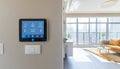 Smart home control panel managing modern apartment lighting and temperature Royalty Free Stock Photo