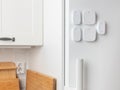 Smart home remotes are mounted on the fridge, including shortcut buttons and multi-function controls, offering minimalist, Royalty Free Stock Photo
