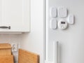 Smart home remotes are mounted on the fridge, including shortcut buttons and multi-function controls, offering minimalist, Royalty Free Stock Photo