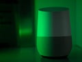 Smart home speaker assistant device in moody coloured LED lighting - Green