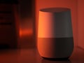 Smart home speaker assistant device in moody coloured LED lighting - Orange