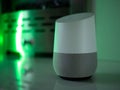 Smart home speaker assistant on fireplace with led coloured ambient lighting - Green