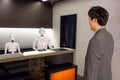 Smart hotel in hospitality industry 4.0  concept, the receptionist robot robot assistant  in lobby of hotel or airports always w Royalty Free Stock Photo