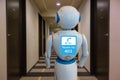 Smart hotel in hospitality industry 4.0 technology concept, robot butler robot assistant use for greet arriving guests, deliver