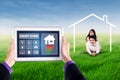 Smart house controller and happy couple Royalty Free Stock Photo