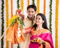 Indian Couple performing or celebrating Gudi Padwa Puja