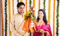 Indian Couple performing or celebrating Gudi Padwa Puja