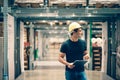 Smart Indian engineer man worker wearing safety helmet doing stocktaking of product management in cardboard box Royalty Free Stock Photo